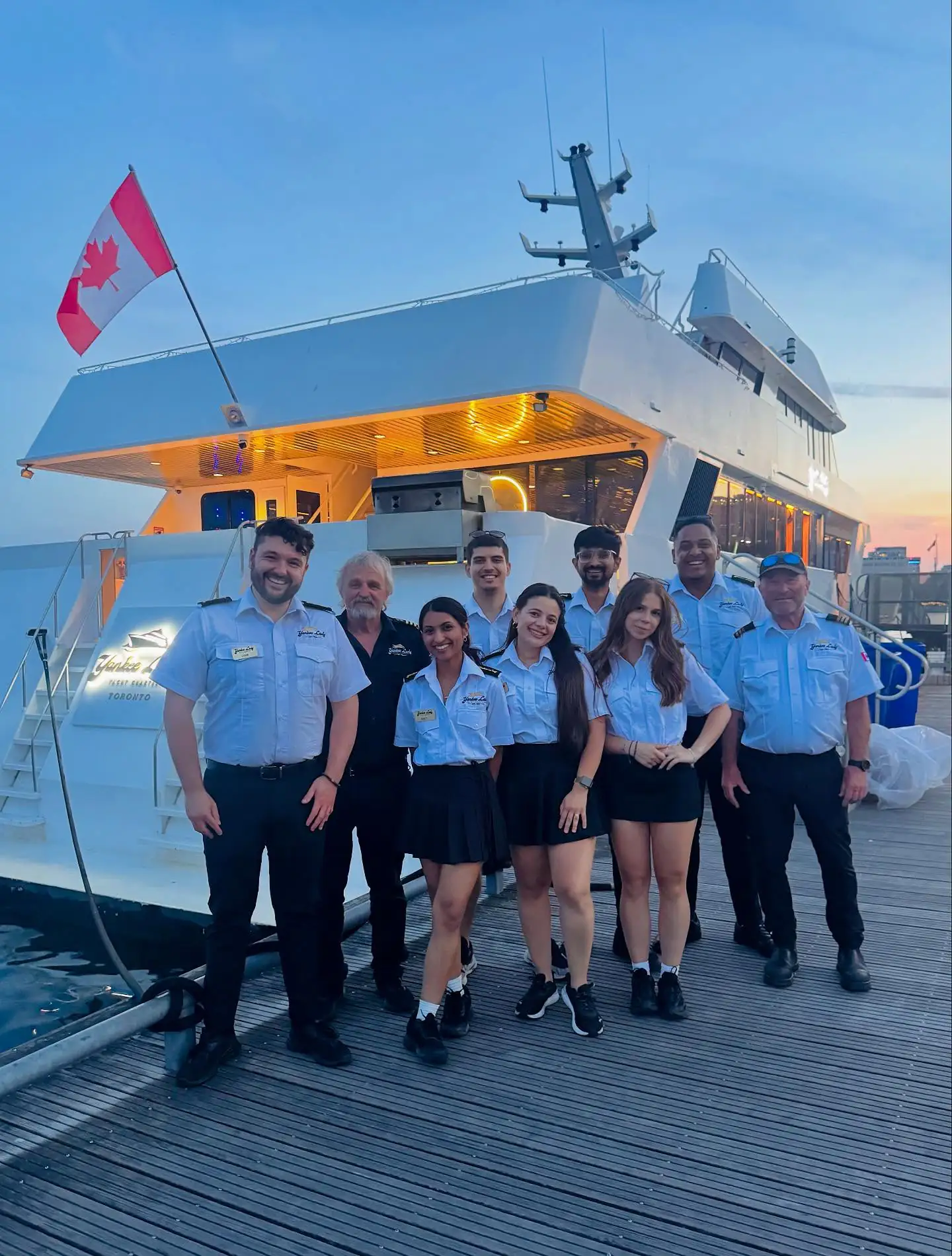 The Yankee Lady crew gathered at the dock at sunset
