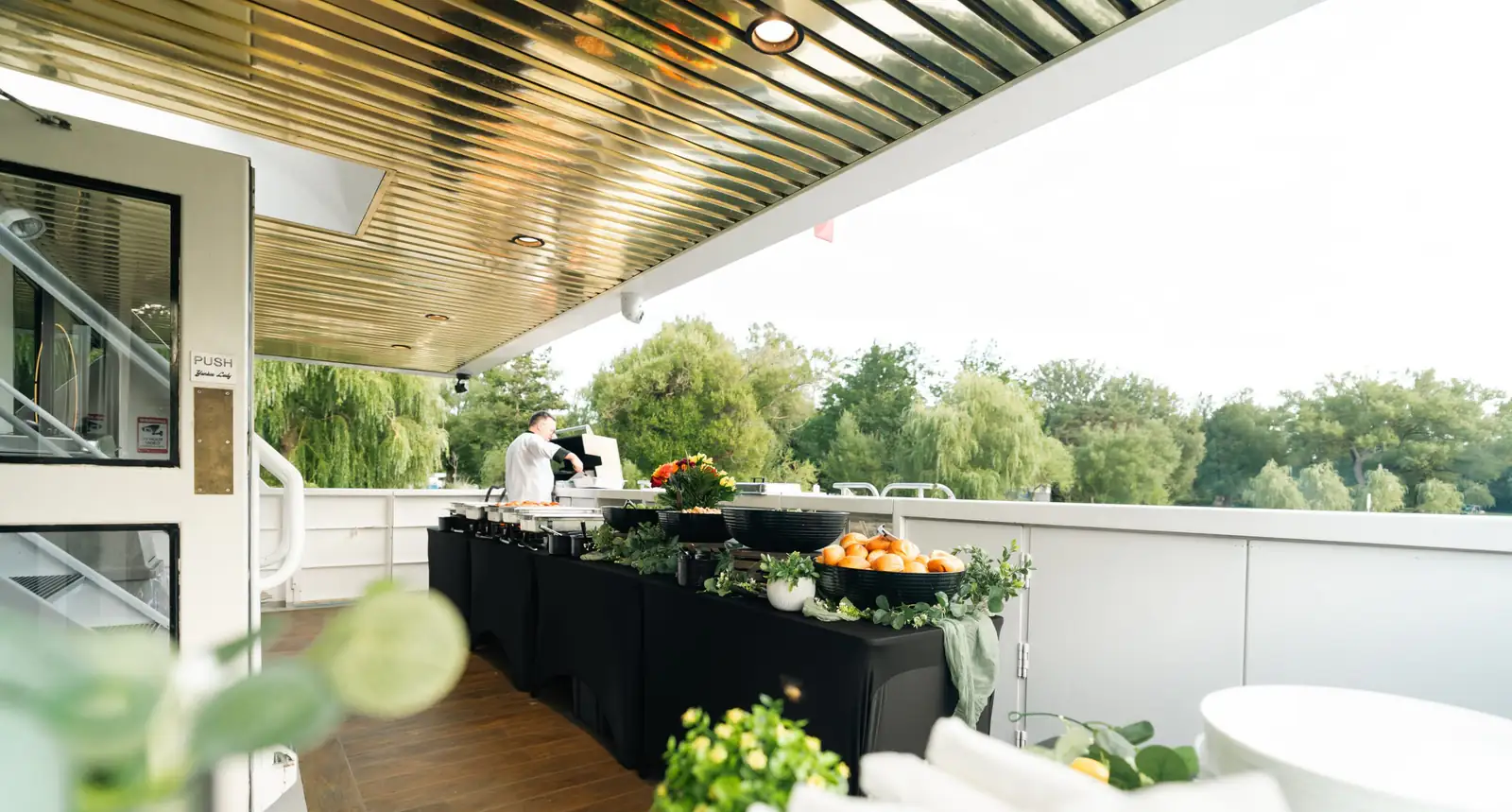 A catered buffet arranged on the outdoor deck