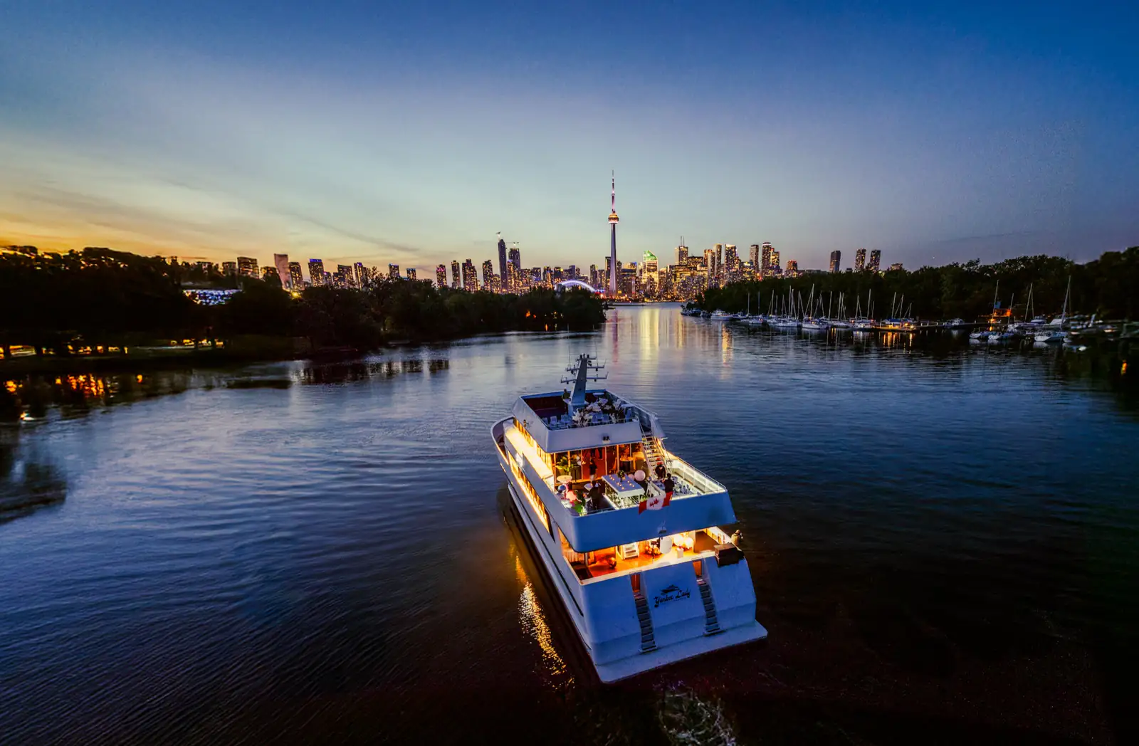 Yankee Lady returning toward the Toronto skyline at dusk
