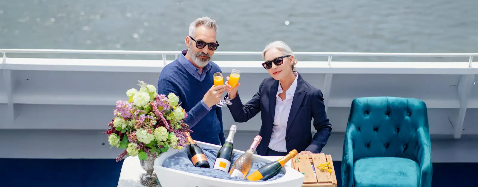 Guests sharing a toast on the open deck