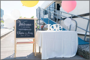 Welcome your wedding guest from the dockside table up the gangway.