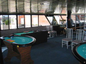 Casino tables set up including black jack and poker.