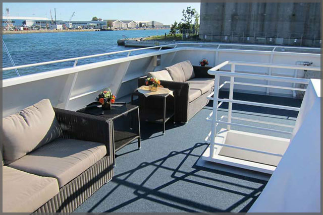 Rental sofas for corporate cruise set up on outside deck.