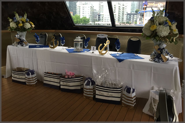 Head table for nautical theme cruise with decor.