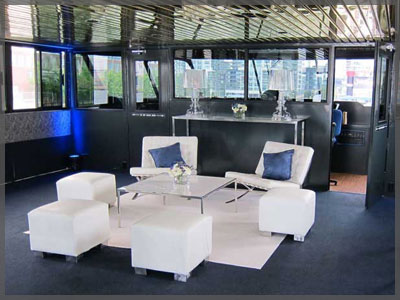 Custom white furniture for corporate event aboard a Toronto boat cruise.