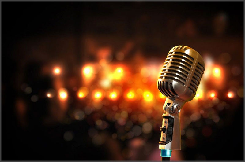 Old style Karaoke microphone with stage lights waiting for the next star.
